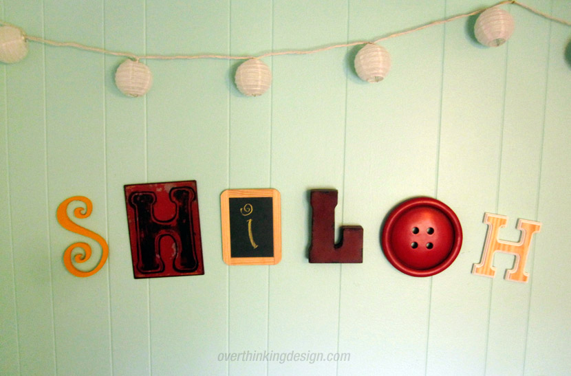 Individual letters placed on the wall to spell the baby's name