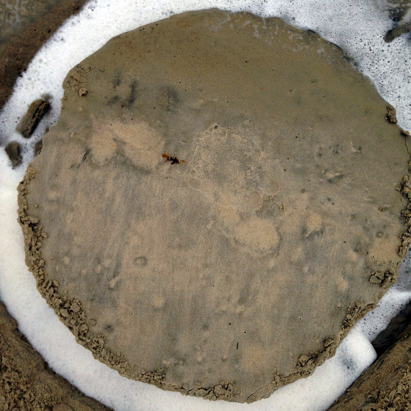 A circle is formed by collecting sea foam in a trench